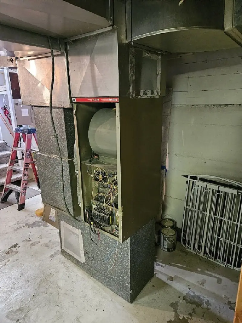 Central Washington Heating and Air diagnosing an aging furnace and ductwork during a repair visit